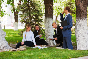 Young business people in a city park